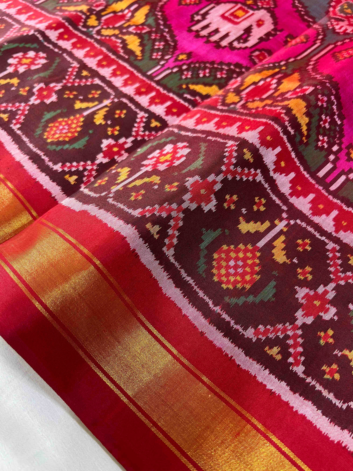 Multiple colours big motifs design with Red flowers bordar Pallu premium single ikkat Patola silk Saree