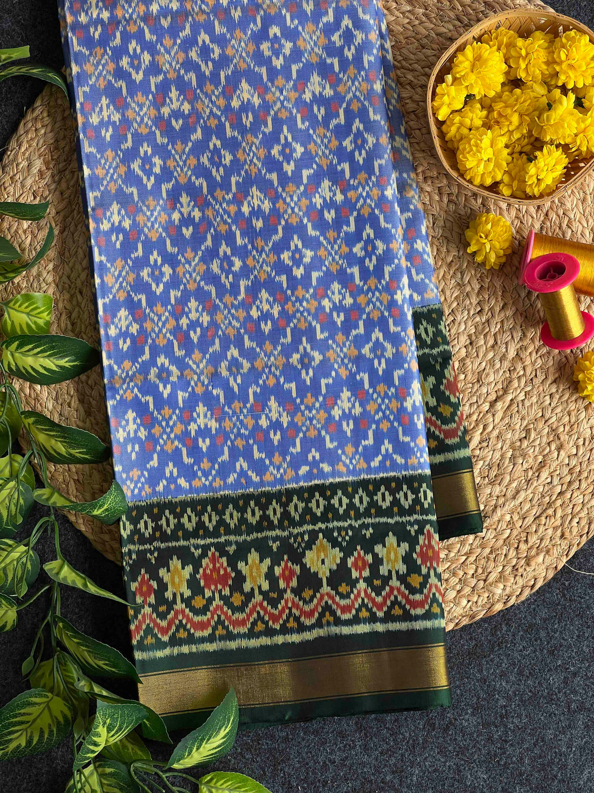 Beautiful sky blue batton-full desing with green bordar Pallu Patola sarees