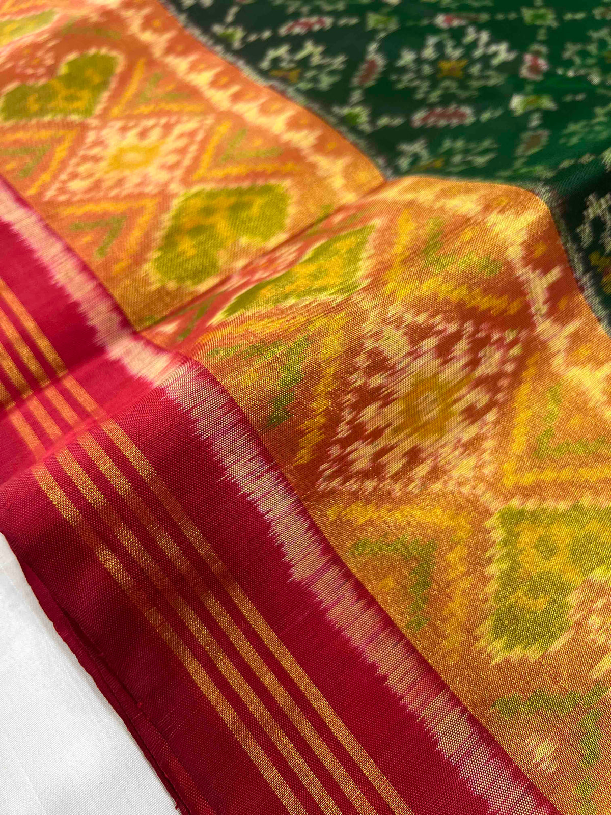 Green panchnanda design with Red flowers Pallu single ikkat Patola silk Saree