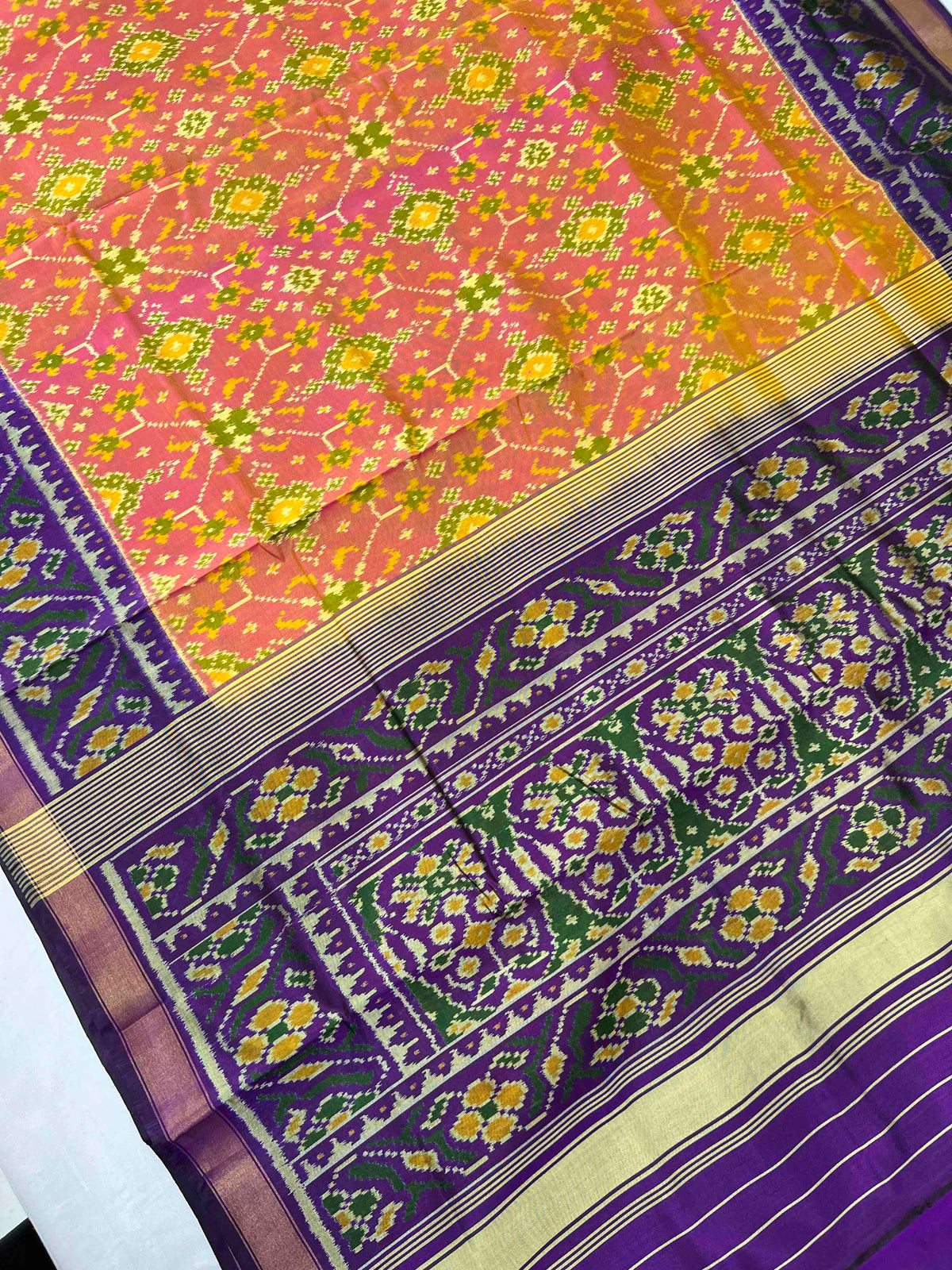 Beautiful peach Navratan with dark purple single ikkat Patola silk Saree