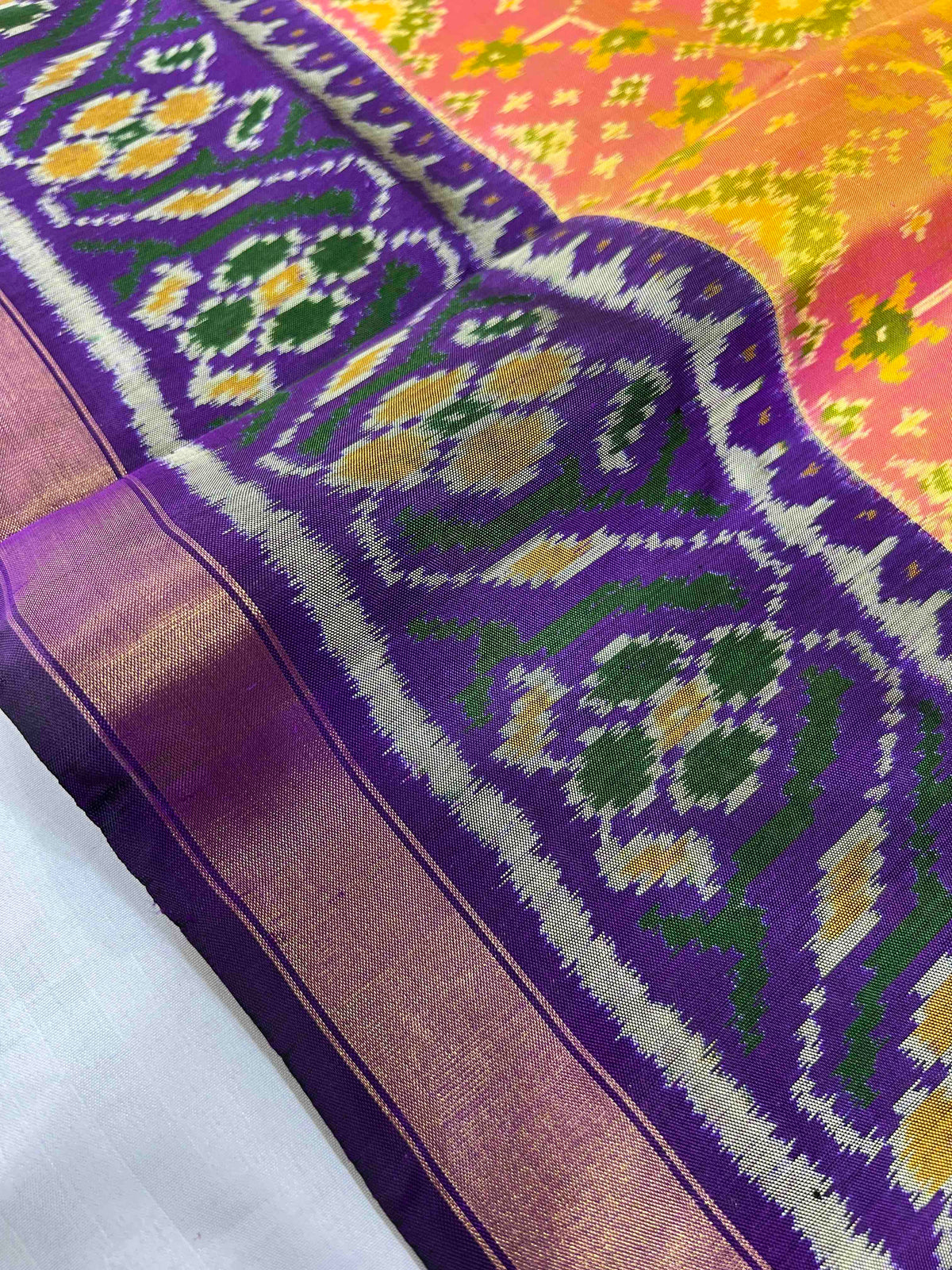 Beautiful peach Navratan with dark purple single ikkat Patola silk Saree