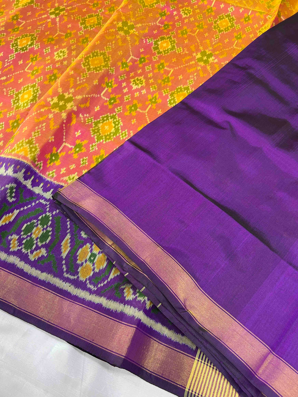 Beautiful peach Navratan with dark purple single ikkat Patola silk Saree