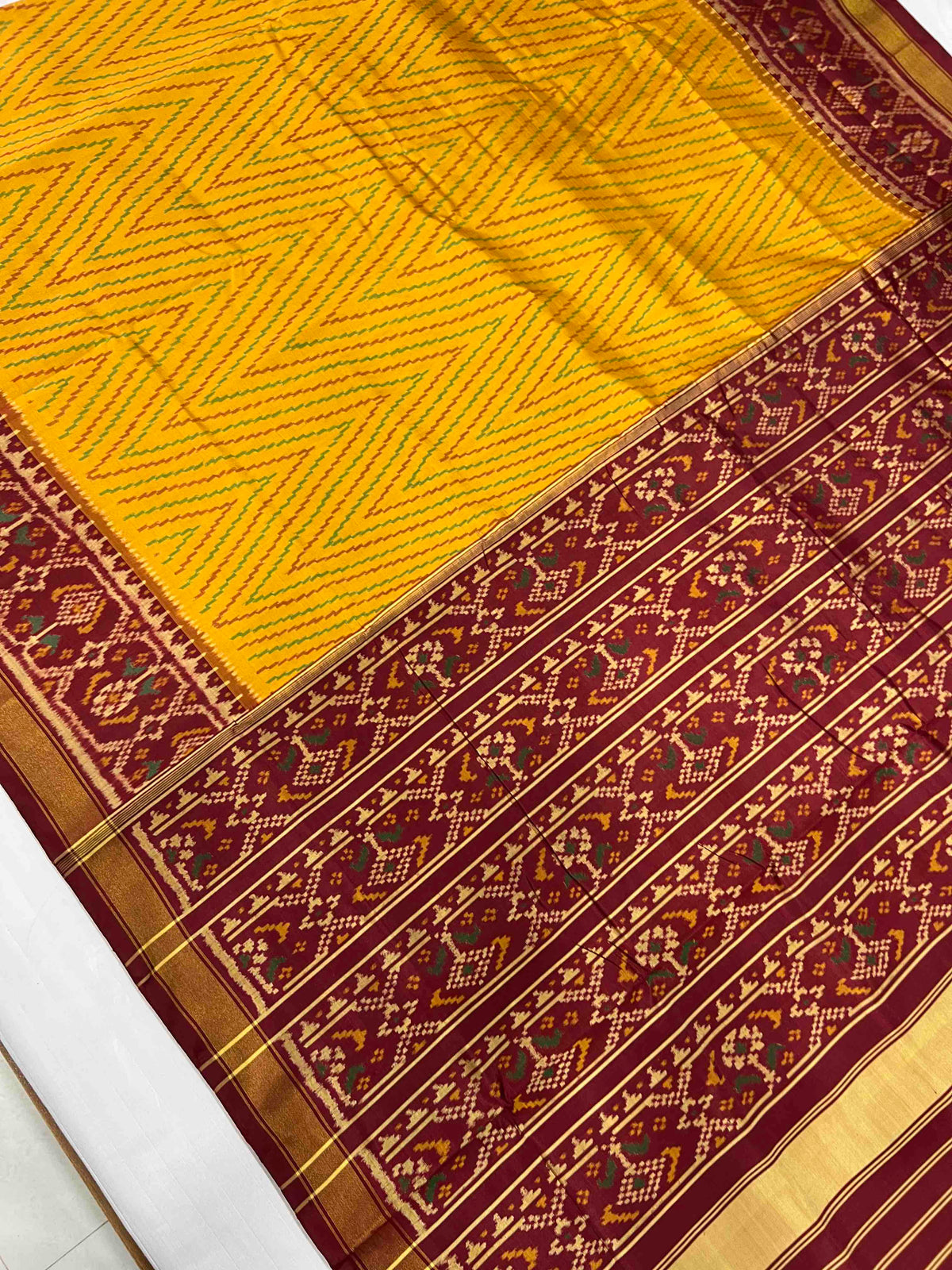 Beautiful yellow laheriya design with red single ikkat Patola silk Saree