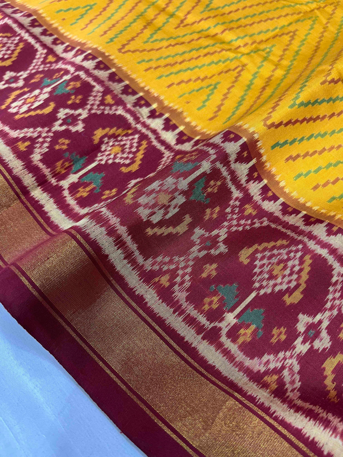 Beautiful yellow laheriya design with red single ikkat Patola silk Saree