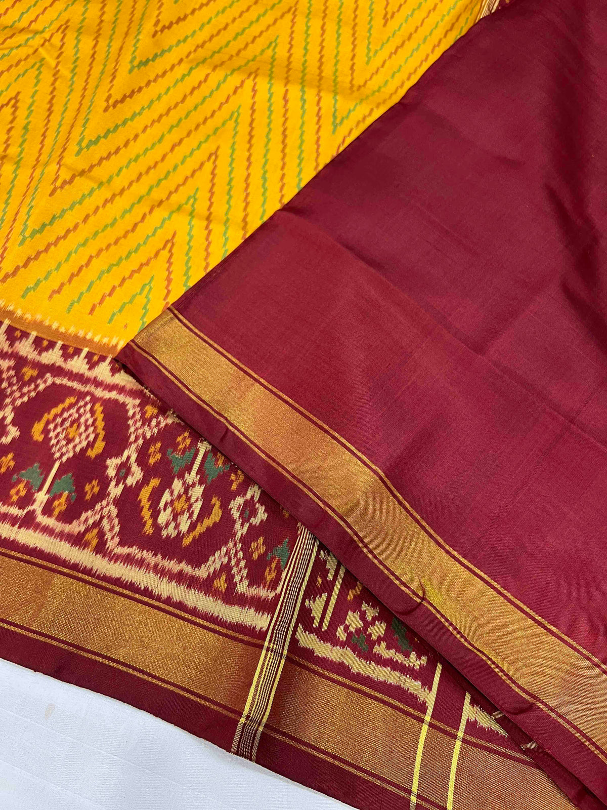 Beautiful yellow laheriya design with red single ikkat Patola silk Saree