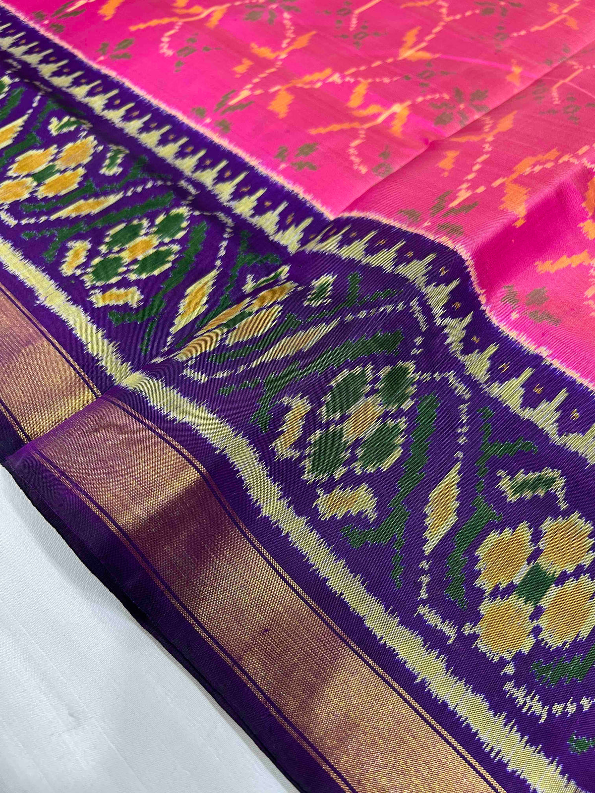 Pink with purple flowers design single ikkat Patola silk Saree
