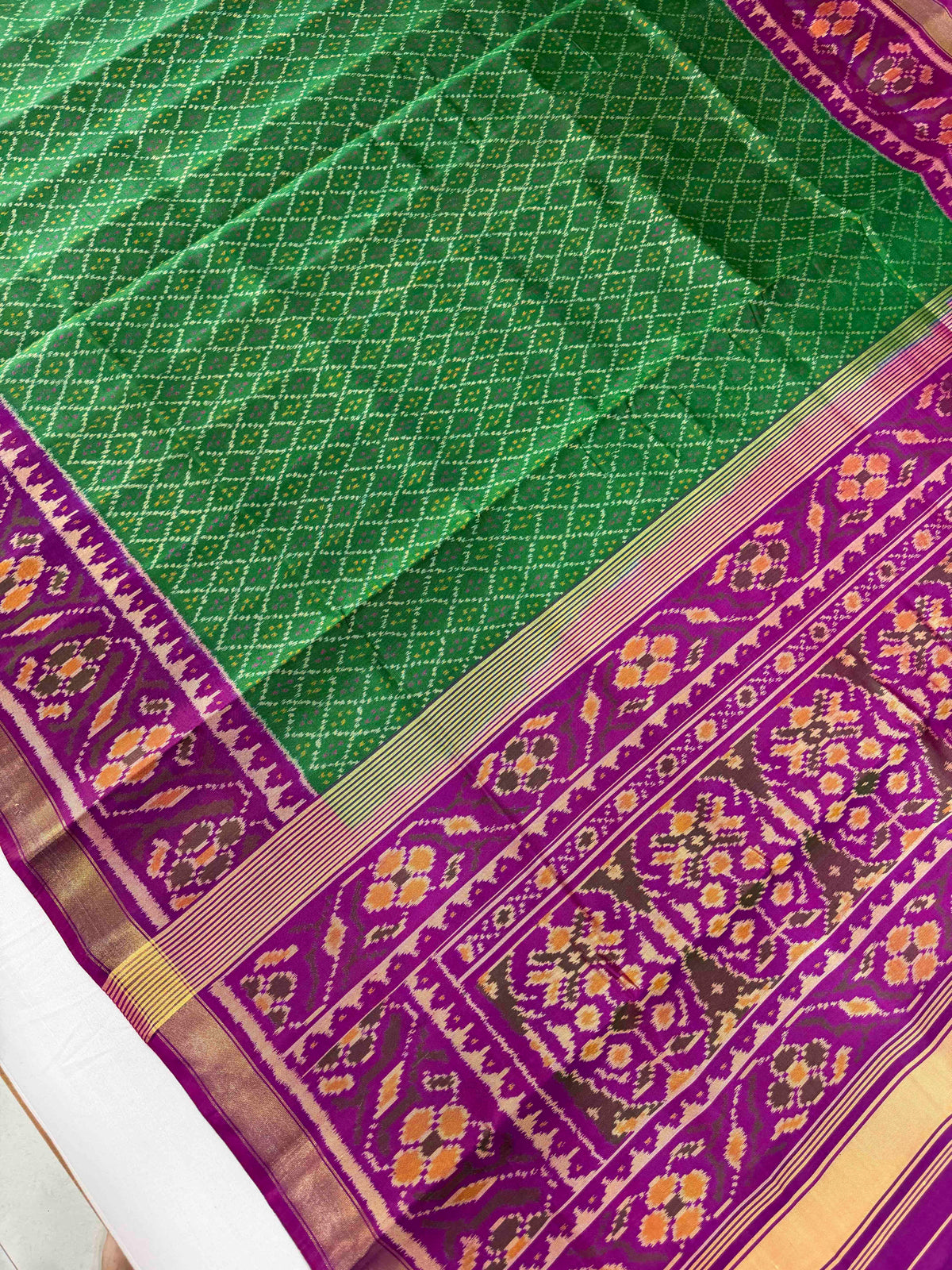 Green daliya bhat design with purple combination Patola silk Saree