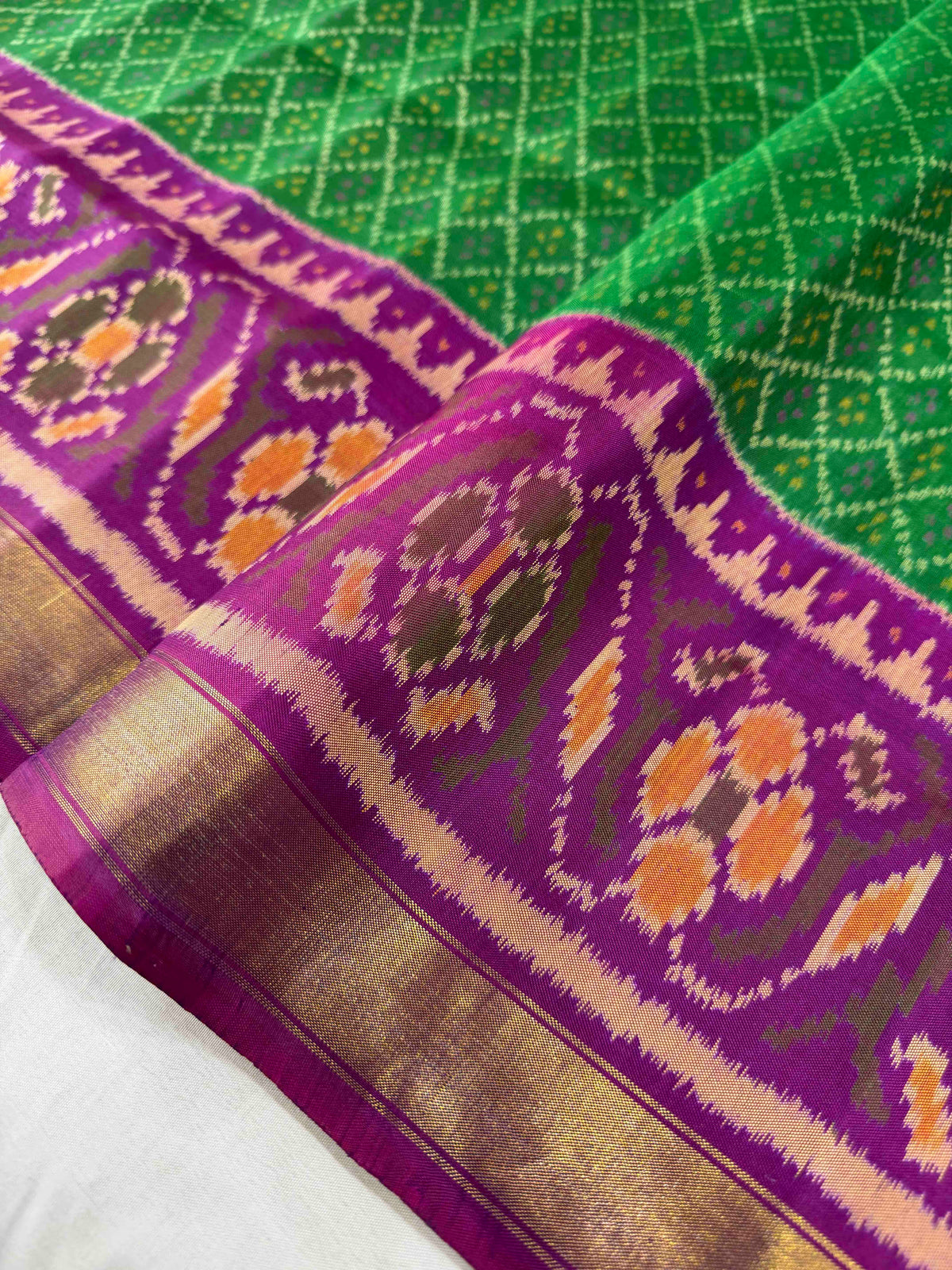 Green daliya bhat design with purple combination Patola silk Saree