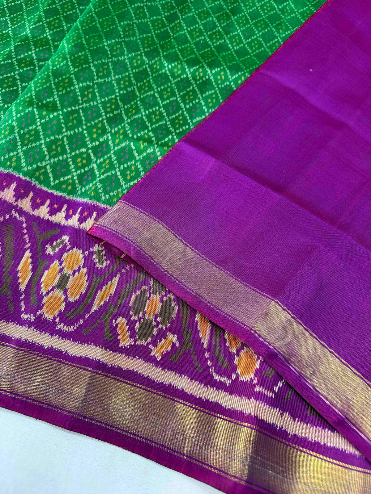 Green daliya bhat design with purple combination Patola silk Saree