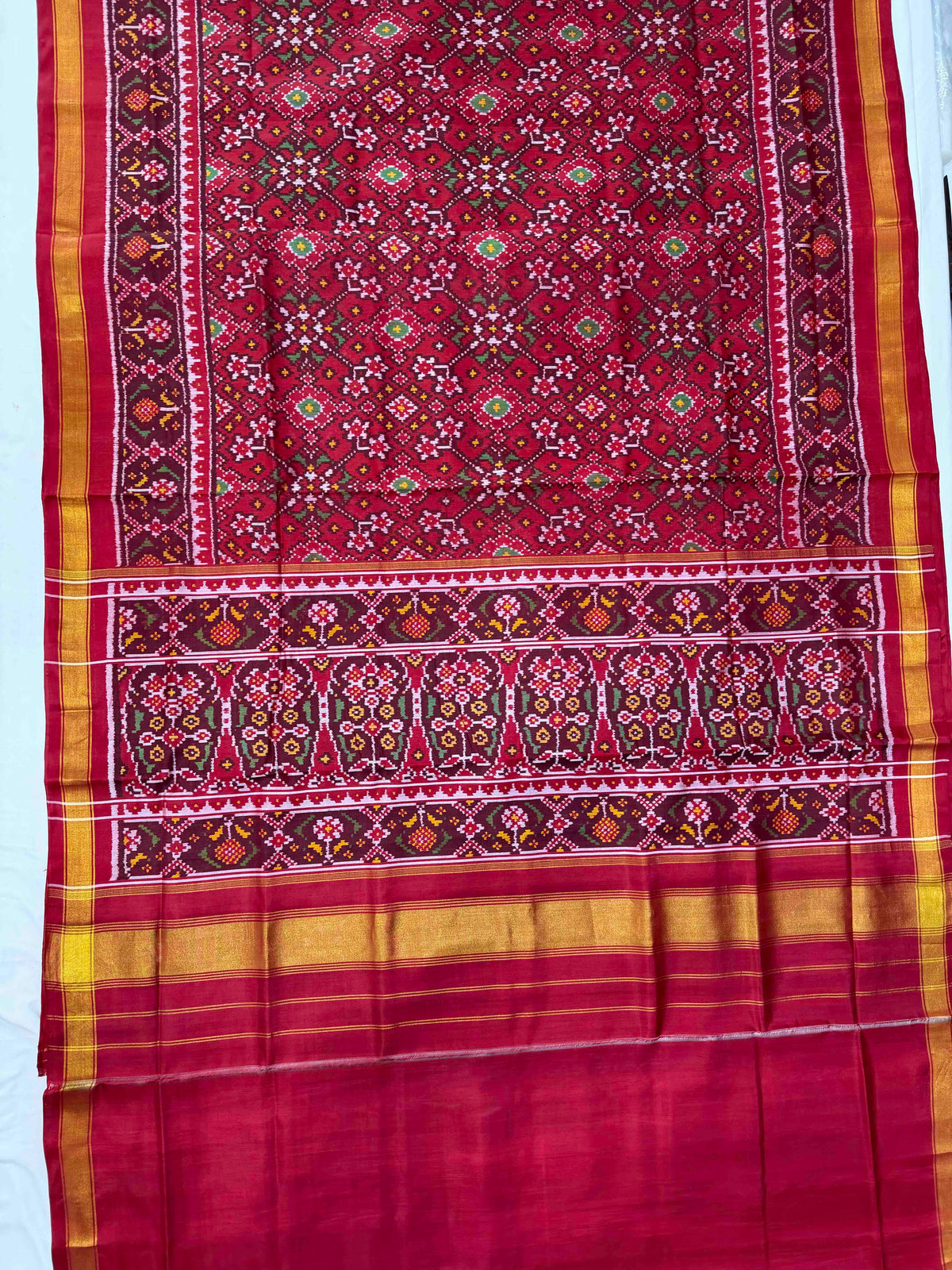 Beautiful maroon Navaratan design single ikkat Patola silk Saree