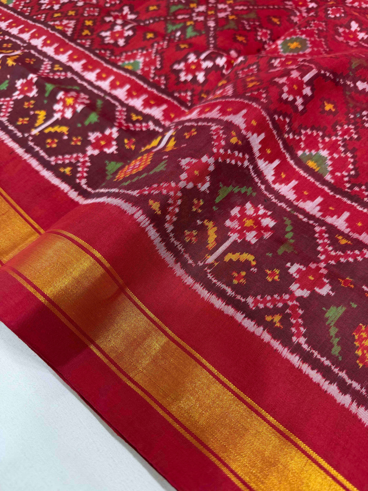 Beautiful maroon Navaratan design single ikkat Patola silk Saree