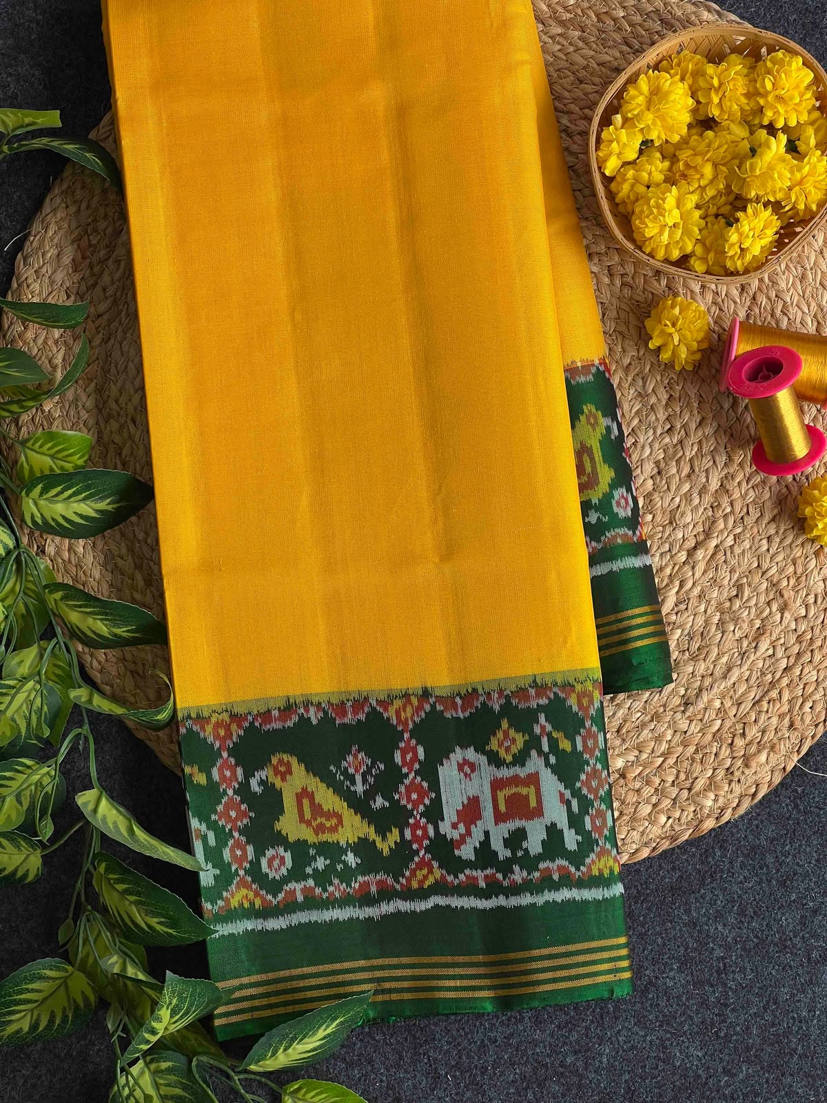 Beautiful plain yellow gala design with green bordar Pallu premium patola silk saree