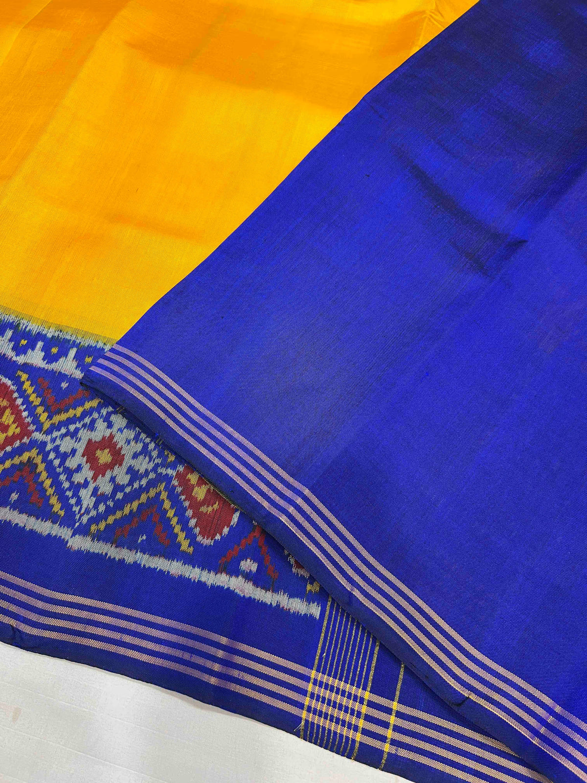Beautiful yellow and blue singal ikkat silk patola saree