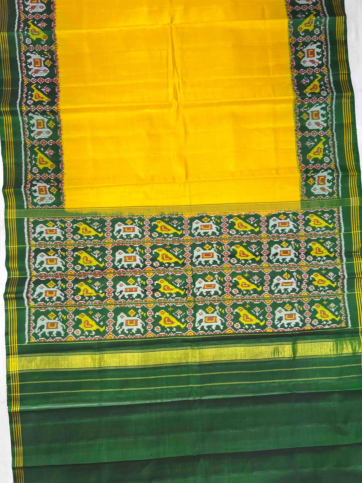 Beautiful plain yellow gala design with green bordar Pallu premium patola silk saree